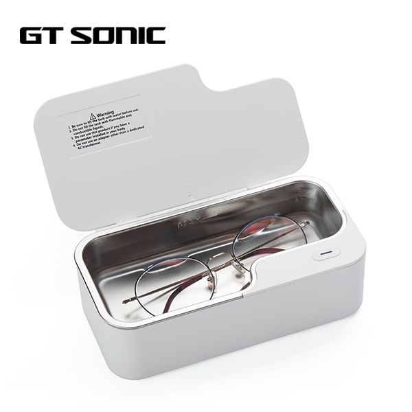 put glasses in an ultrasonic cleaner