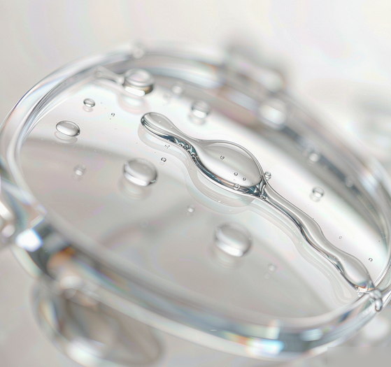 Coated eyeglass lenses in water for gentle ultrasonic cleaning